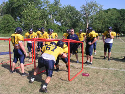 Linemen lock shoulder pads during a drill to improve blocking as the Marian College football team prepares for its first game on Sept. 1.