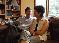 Deacon candidate Ron Reimer laughs with his wife, Susie, at their home in Greenwood. They are members of SS. Francis and Clare of Assisi Parish in Greenwood. (Photo by Sean Gallagher)	