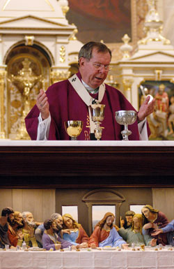 Archbishop Daniel M. Buechlein celebrates the eucharistic liturgy at the historic altar in the Old Cathedral Basilica of St. Francis Xavier in Vincennes, Ind., on March 18 during the archdiocesan jubilee pilgrimage. The altar features a depiction of the Last Supper. (Photo by Mary Ann Wyand) 