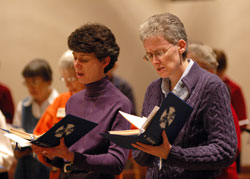 Benedictine Sisters Marie Therese Racine, left, and Maureen Therese Cooney pray during evening prayer on Dec. 3 at Our Lady of Grace Monastery Chapel in Beech Grove. (Photo by Mary Ann Wyand)