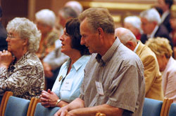 Janis and Gordon Becker, members of St. John the Apostle Parish in Bloomington, kneel in prayer during the Miter Society Mass on May 5 at SS. Peter and Paul Cathedral in Indianapolis. (Photo by Sean Gallagher)