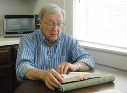 In retirement, Father Francis “Frank” Bryan continues to make praying the Liturgy of the Hours a part of his life. (Photo by John Shaughnessy)