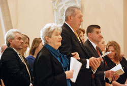 Marie Tobin holds her son Jim’s arm during the installation Mass for her oldest son, Archbishop Joseph W. Tobin, on Dec. 3 at SS. Peter and Paul Cathedral in Indianapolis. (Photo by Father Shaun Whittington)