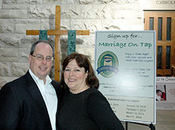 Steve and Therese Hartley stand in the narthex of St. Luke the Evangelist Church on Oct. 23. The couple is involved in the parish’s Marriage on Tap program, which aims to strengthen marriages among Catholic couples. (Photo by John Shaughnessy)