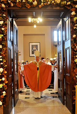 “This is the Lord’s gate: let us enter through it and obtain mercy and forgiveness,” Archbishop Joseph W. Tobin declares as he opens the doors of mercy at SS. Peter and Paul Cathedral in Indianapolis on Dec. 13. (File photo by Natalie Hoefer)