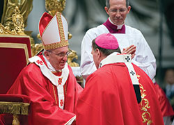 Pope Francis greets Archbishop Joseph W. Tobin of Indianapolis after presenting him with a pallium during a Mass marking the feast of Sts. Peter and Paul in St. Peter’s Basilica at the Vatican on June 29, 2013. (CNS photo/Alessia Giuliani, Catholic Press Photo)