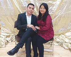 Newlyweds Luis and Clare Gomez pose for a photo at the Marriage Day Celebration reception at the Archbishop Edward T. O’Meara Catholic Center in Indianapolis on Feb. 12 after a Mass honoring all married couples at SS. Peter and Paul Cathedral in Indianapolis. The Gomezes received recognition and a papal blessing during the Mass for being the most recently married couple present. (Submitted photo)