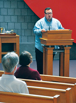 Kile Stevens, a member of St. Joseph Parish in Shelbyville, leads the congregation in the responsorial psalm at St. Thomas Aquinas Church in Indianapolis on Sept. 24 during a special Mass for those affected by mental illness. (Photo by Natalie Hoefer)