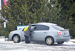 Sidewalk counselor Sheryl Dye speaks with a person pulling into the Planned Parenthood abortion center driveway in Indianapolis on Feb. 20—a Wednesday, one of the days abortions are performed at the facility. (Photo by Natalie Hoefer)