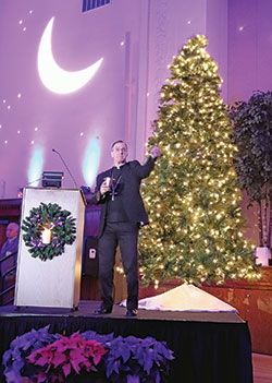 Archbishop Charles C. Thompson blesses those present during the 2018 archdiocesan “An Evening of Lights” event at the Archbishop Edward T. O’Meara Catholic Center in Indianapolis. (Submitted photo)