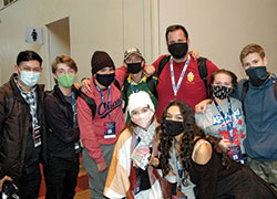 Youth minister Mike Sylvester of St. Gregory the Great Parish in Bluffton, S.C., towers above some of the 23 youths he led at the National Catholic Youth Conference in Indianapolis. (Photo by John Shaughnessy)