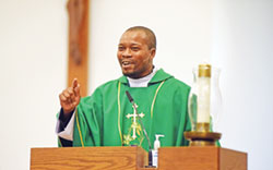 Marianhill Father Tiago Vilancula preaches a homily during a Feb. 15 Mass at St. Christopher Church in Indianapolis. He is one of 17 international priests to come to serve in the archdiocese since 2020. (Photo by Sean Gallagher)