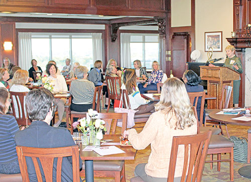 Sue Ellspermann, right, president of Ivy Tech Community College in Indianapolis, speaks with women of the archdiocese about women’s philanthropy during a gathering at the college launching the archdiocese’s Catholic Women’s Giving Circle on April 24. (Photo by Jennifer Lindberg)