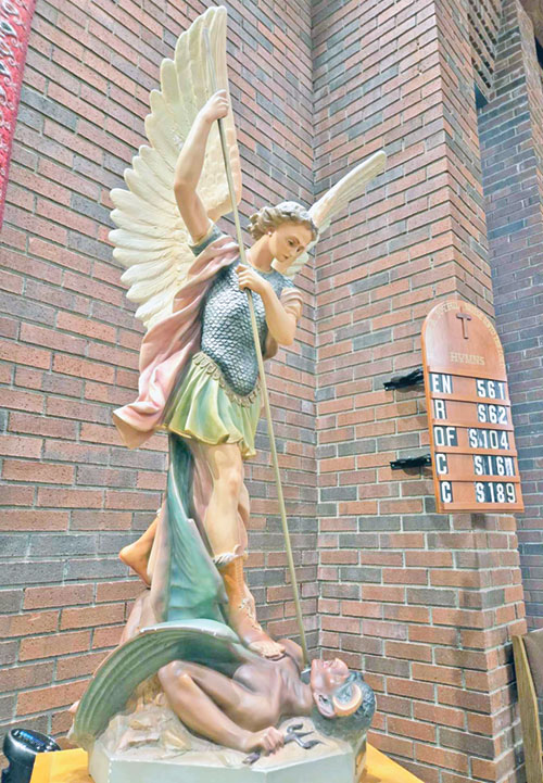 A statue of St. Michael the Archangel defeating the devil is seen in St. Michael Church in Bradford in the New Albany Deanery. (Submitted photo)