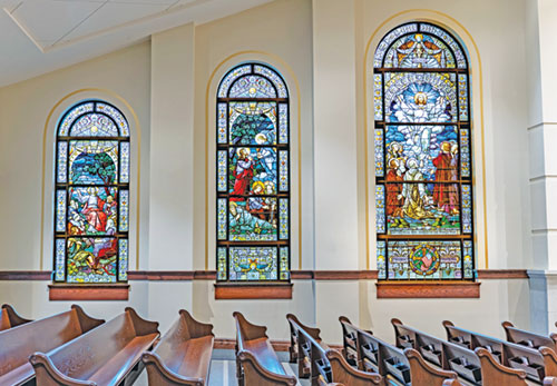 Stained-glass windows that were originally in the former Holy Cross Church in Indianapolis are seen in St. John Paul II Church in Sellersburg. (Submitted photo) 